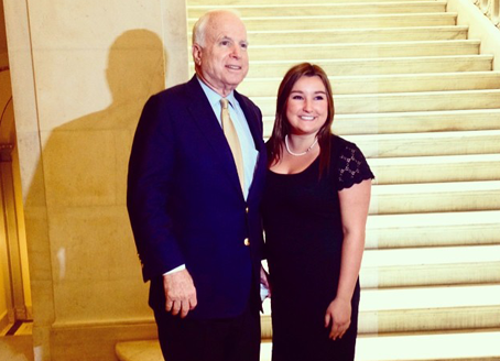 Senator John McCain and an ASU Capital Scholars student posing for a photo