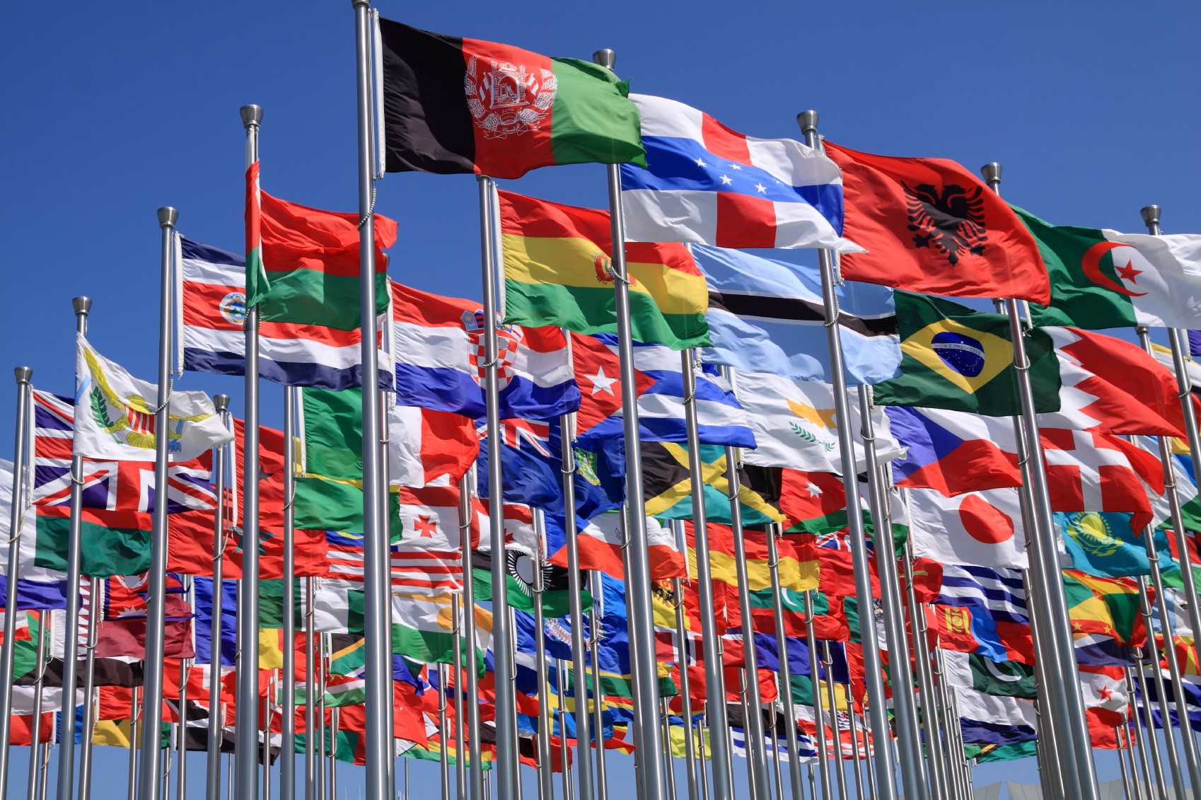 A massive cluster of country flags from around the world