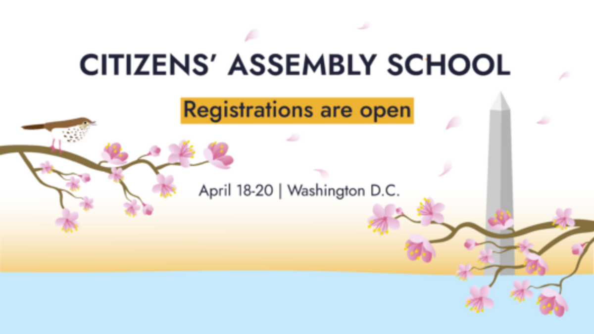 Image of Citizens' Assembly School with cherry blossoms and Washington Monument in background
